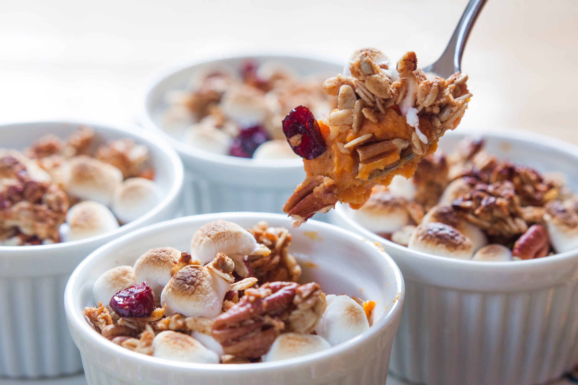 Mini Thanksgiving sweet potato casseroles with marshmallow and granola