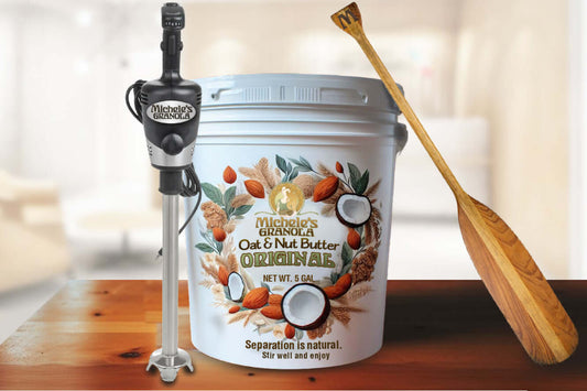 Michele's Original Oat & Nut Butter 5-gallon bucket with blender and oar