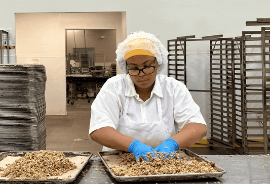 Team member Miracle mixing up our granola by hand