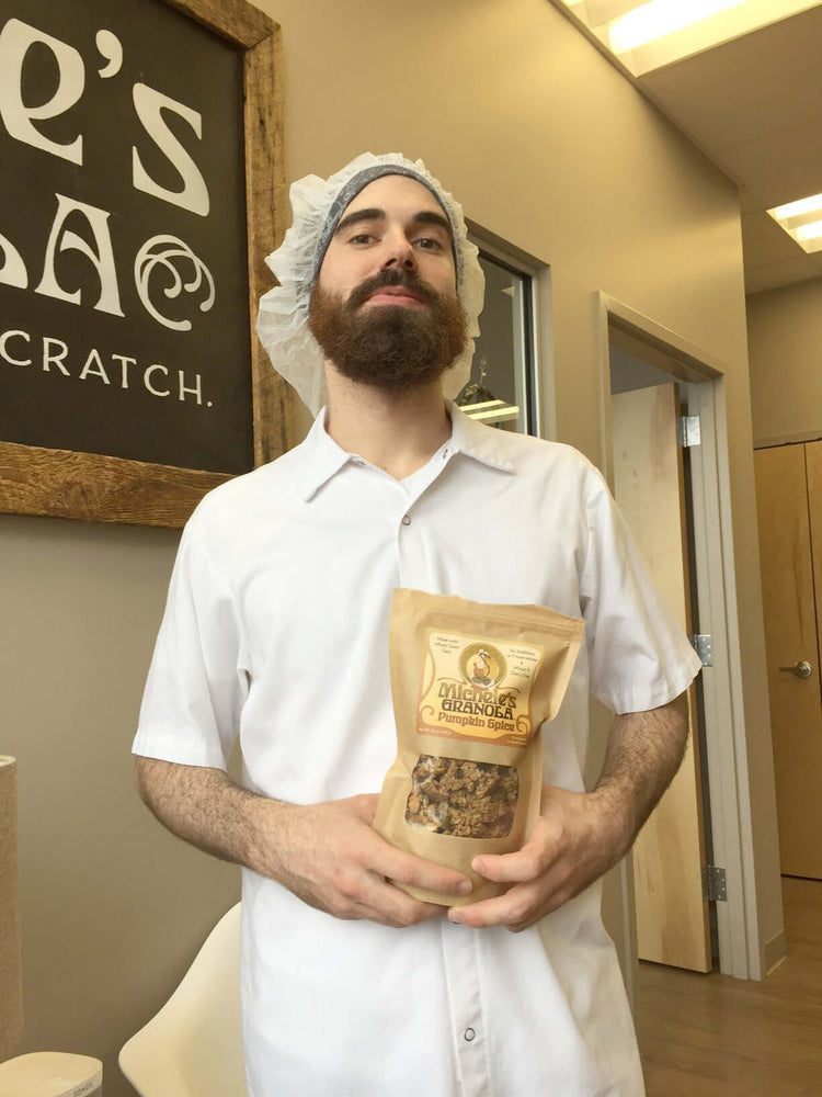 Man with beard holding granola
