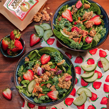 Michele's Limited Edition Strawberry & Red Quinoa Granola over a fresh green salad